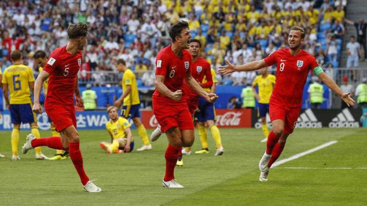 Harry Maguire of England celebrates with Harry Kane of England and John Stones of England after scoring his side's first goal to make the score 0-1 during the 2018 FIFA World Cup.