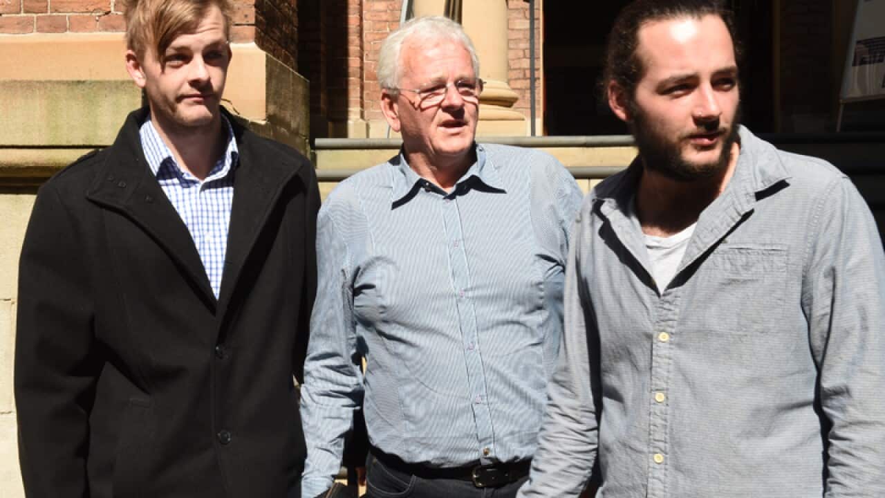 Daniel Christie's father Michael (C) with sons John (L) and Peter