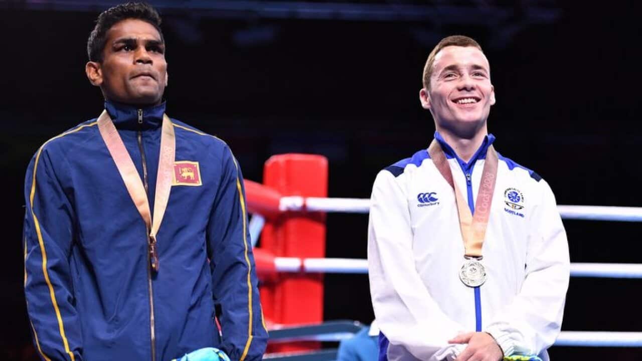 Bronze medallists Sri Lanka's M Vidanalange Ishan Bandara (L)
