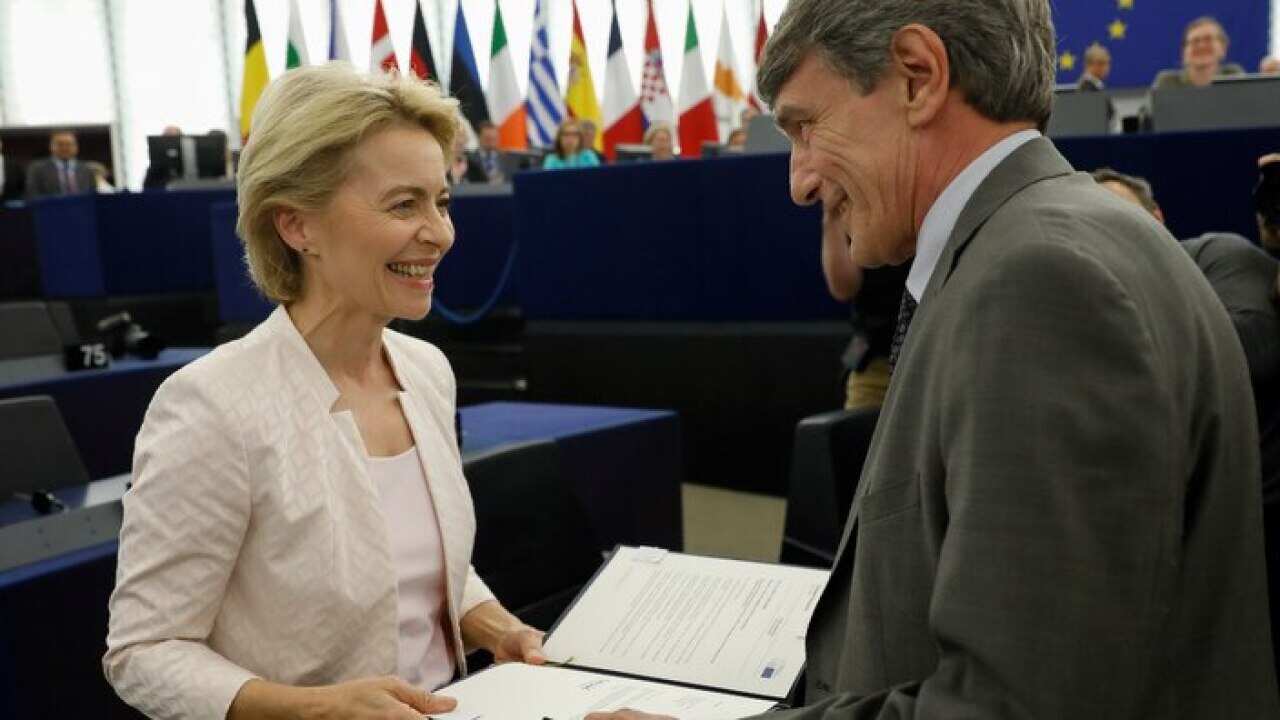 European Parliament President David-Maria Sassoli, right, talks to Ursula von der Leyen