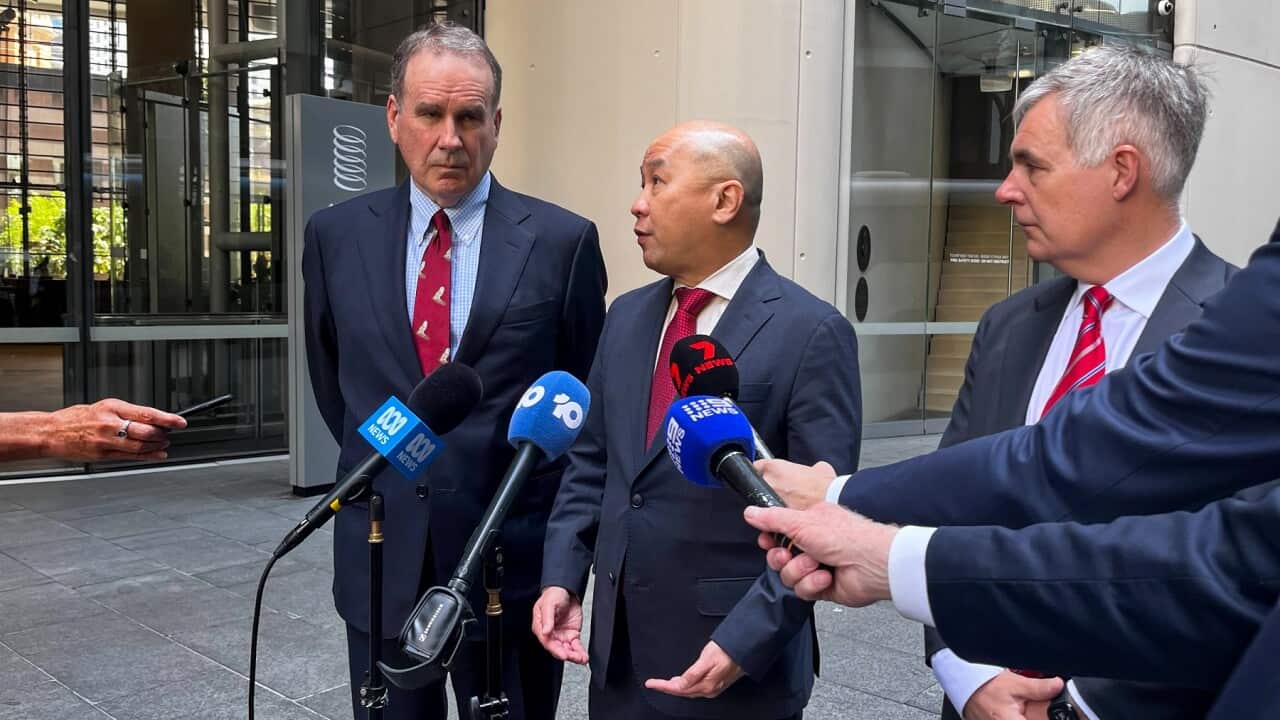 Optus chairman John Arthur, Singtel CEO Yuen Kwan Moon and Optus CEO Stephen Rue speak to the media (AAP)