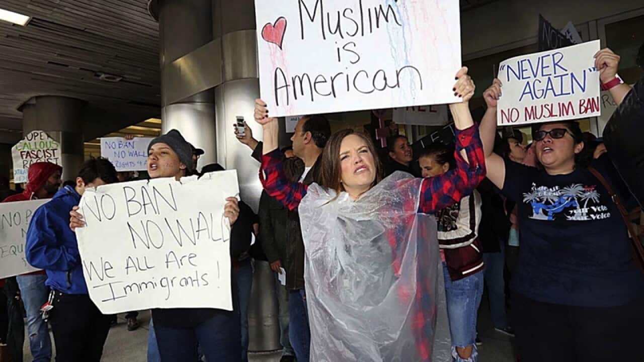 Protesters rally at Miami International Airport