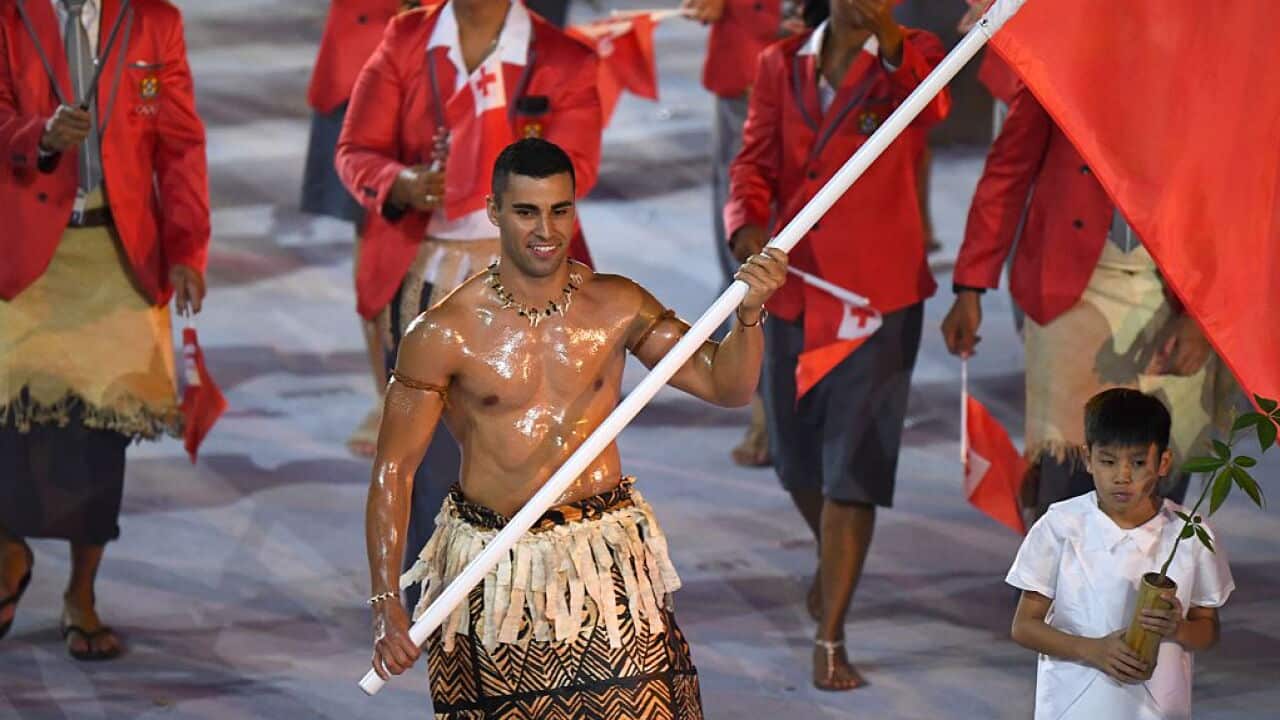 Tonga's flagbearer Pita Nikolas Taufatofua leads his delegation during the opening ceremony of the Rio 2016 Olympic Games at the Maracana stadium in Rio de Janeiro on August 5, 2016.