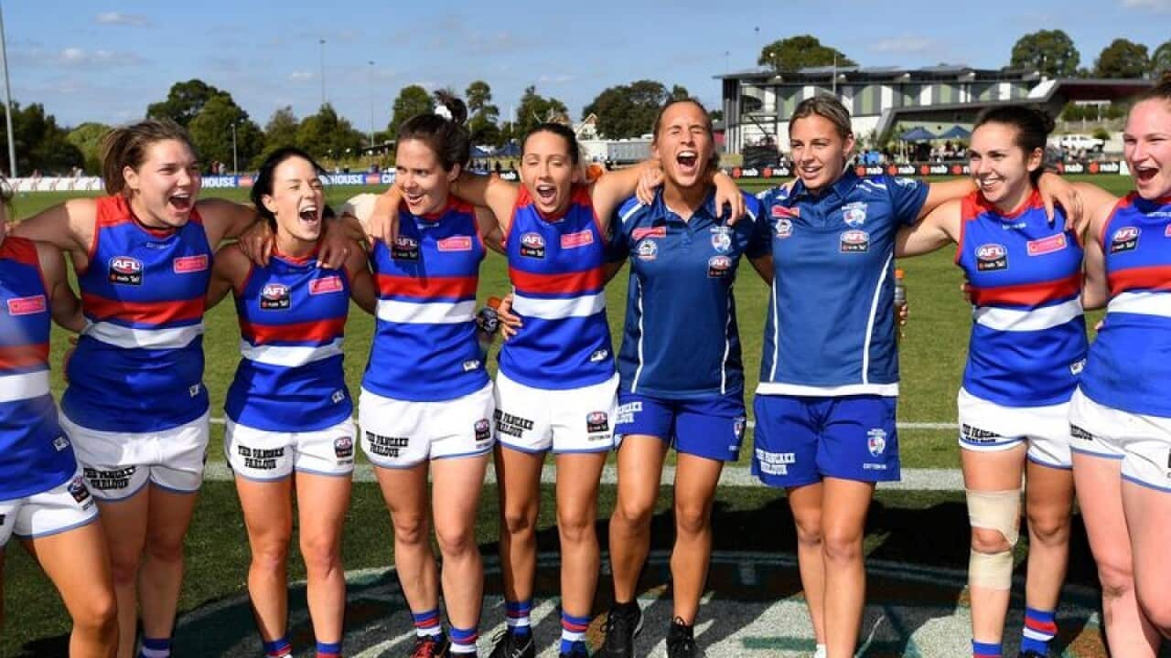 The Western Bulldogs AFLW team celebrate winning a match.