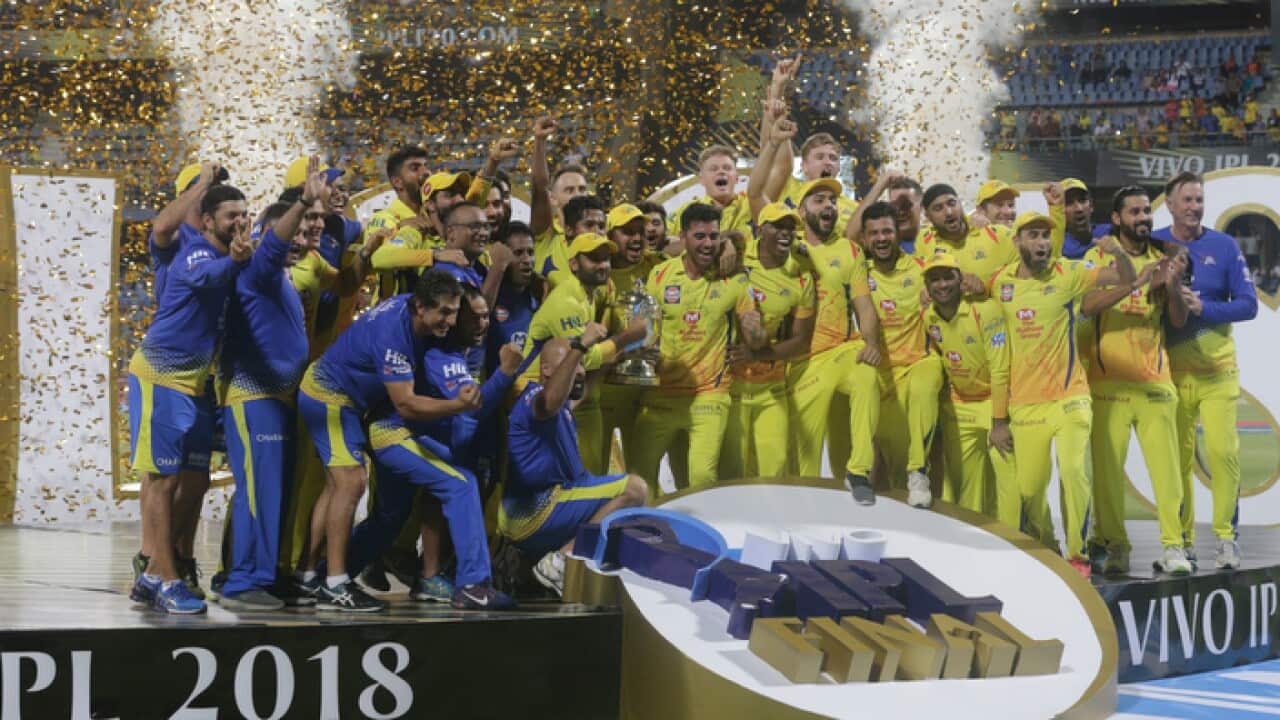 Members of Chennai Super Kings pose with trophy after winning IPL final against Sunrisers Hyderabad.