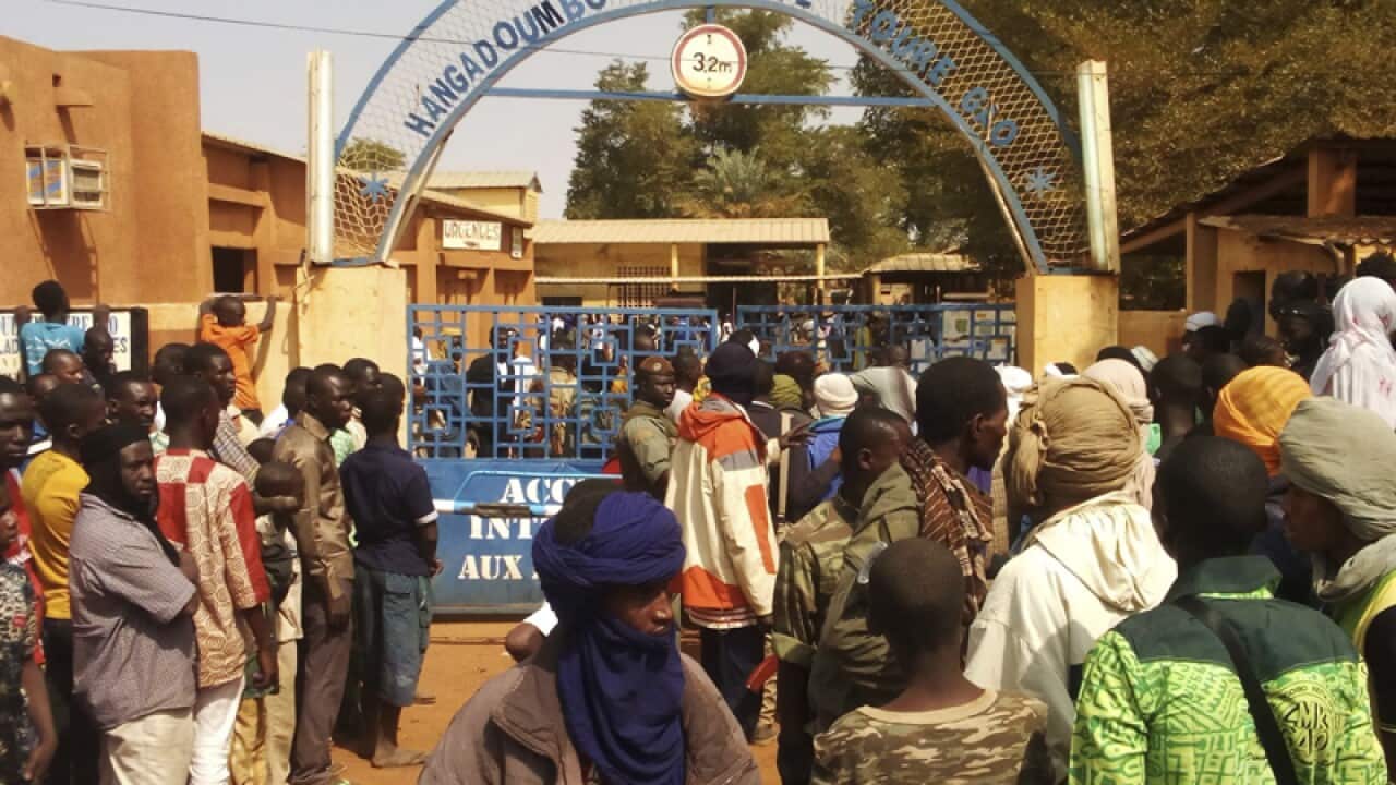 People gather outside a hospital were injured were taken