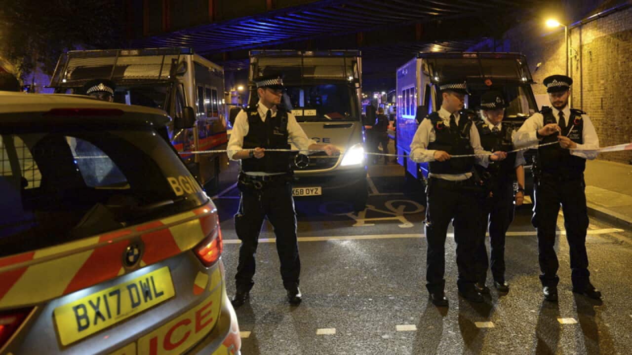 Police officers man a cordon at Finsbury Park in London