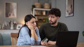 Couple having financial stress with credit card debt