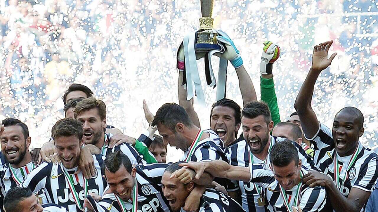 Juventus' players celebrate the Italian championship trophy