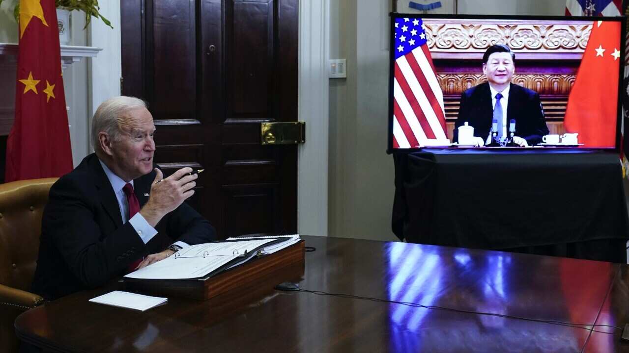 US President Joe Biden holds an online meeting with Chinese President Xi Jinping from the Roosevelt Room of the White House in Washington on 15 November 2021.