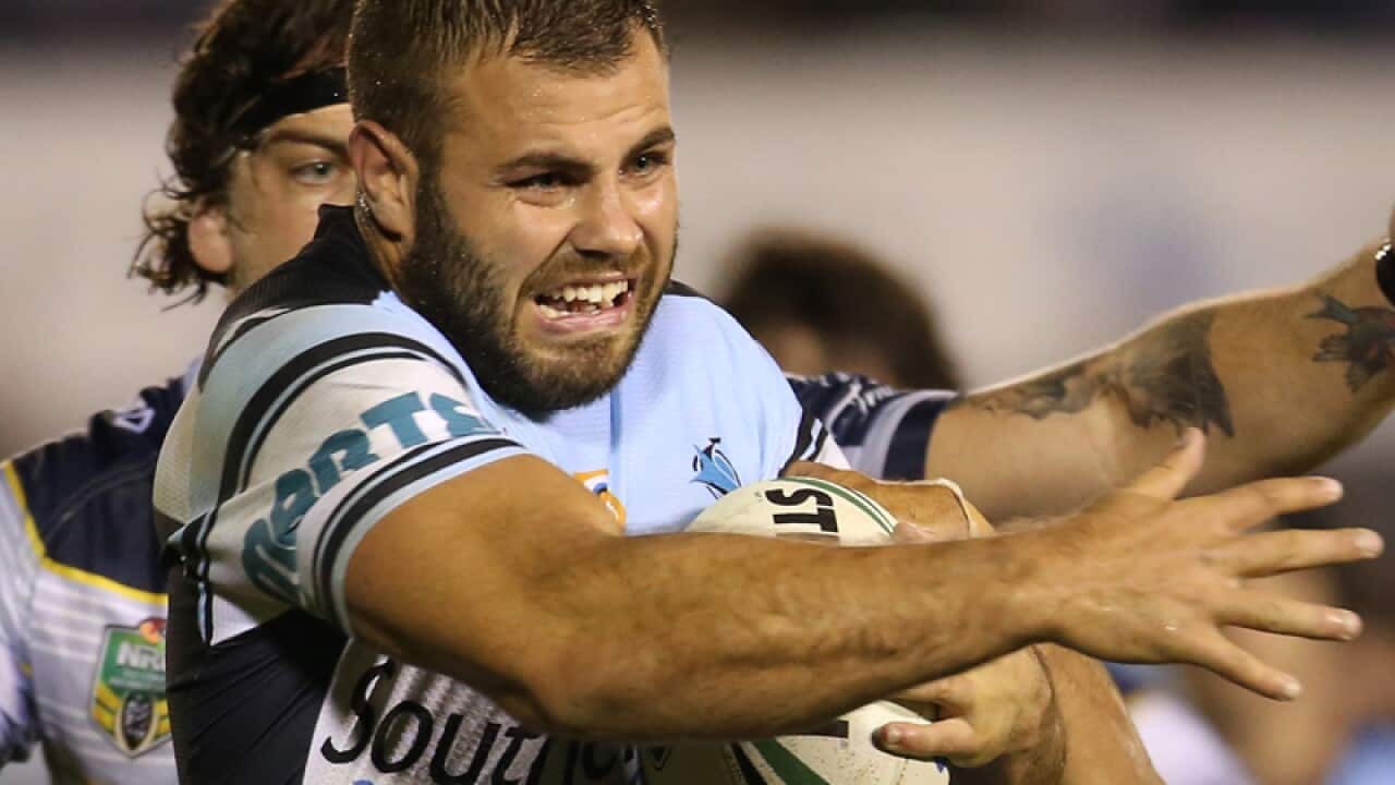 Wade Graham of the Sharks (centre)