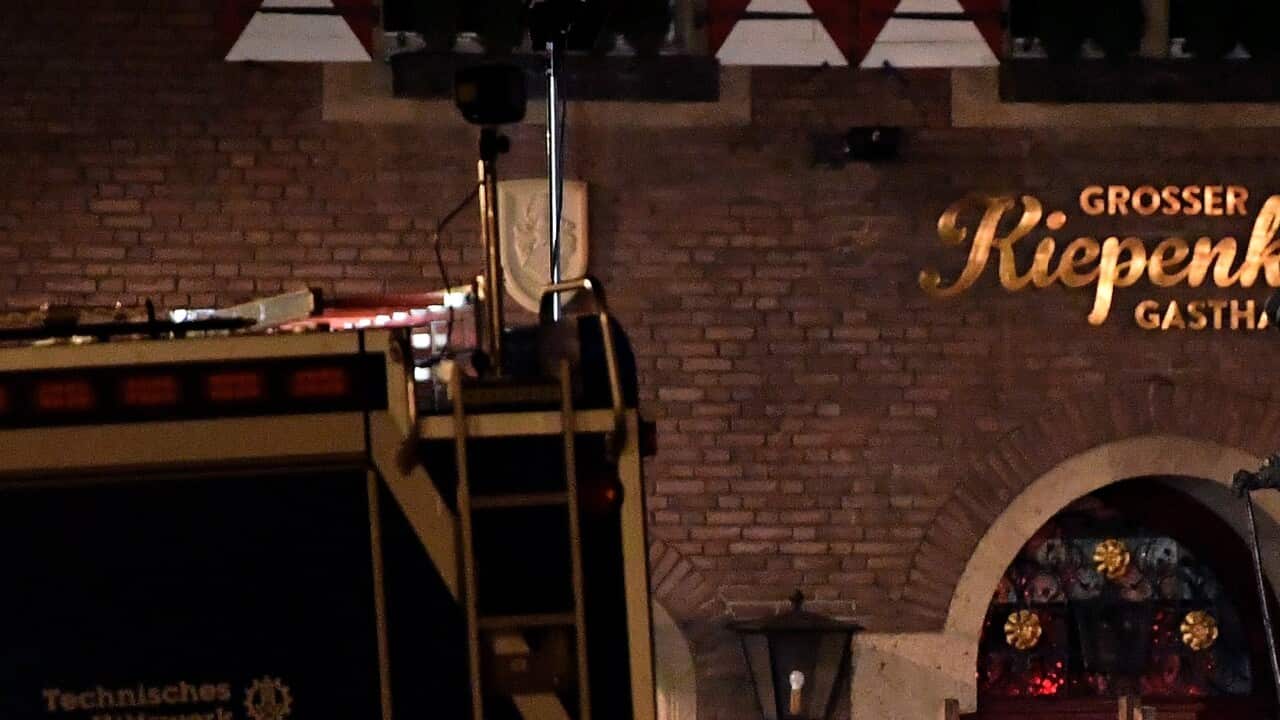 Members of the state office of criminal investigation are seen at the crime scene in the inner city of Muenster, Germany, 08 April 2018.