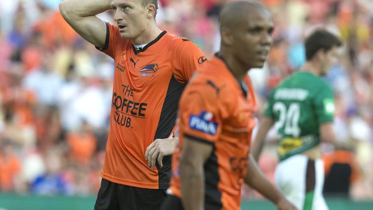 Brisbane defender Ivan Franjic (L)