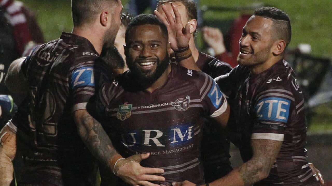 Manly players celebrate after Akuila Uate scored his second try