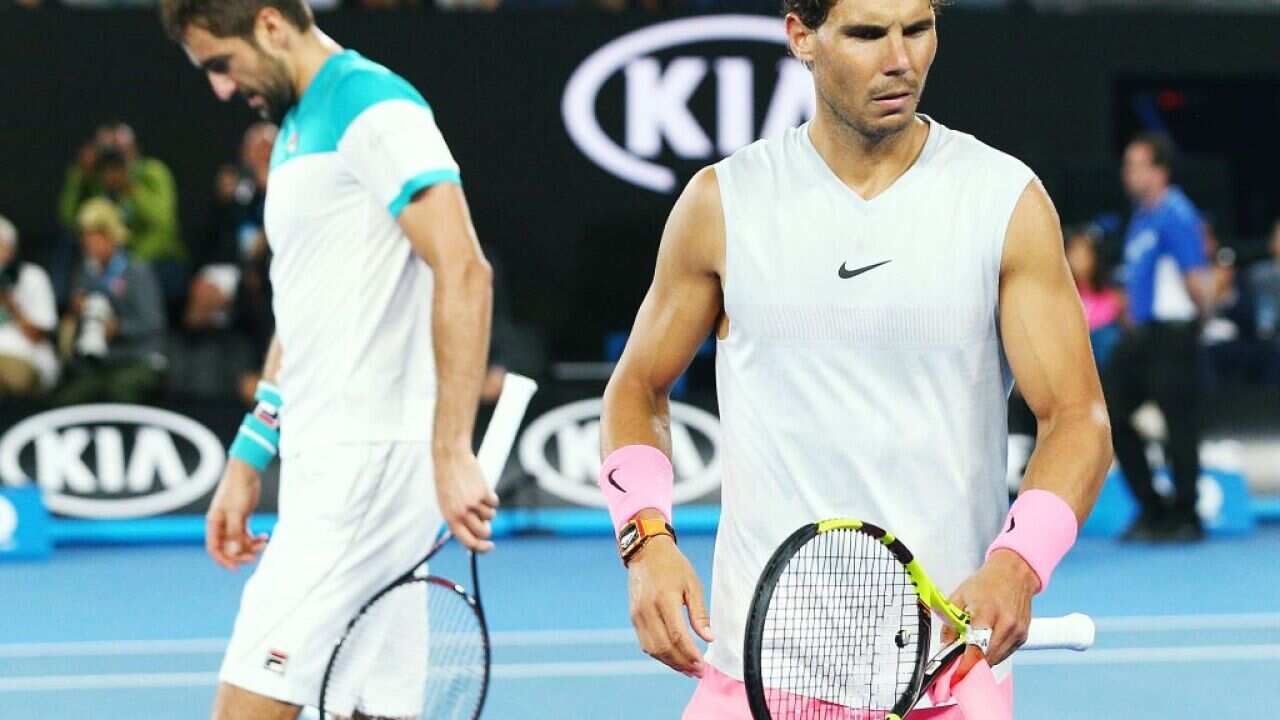 Marin Cilic (left) reached the semifinals after Rafael Nadal´s unexpected retirement