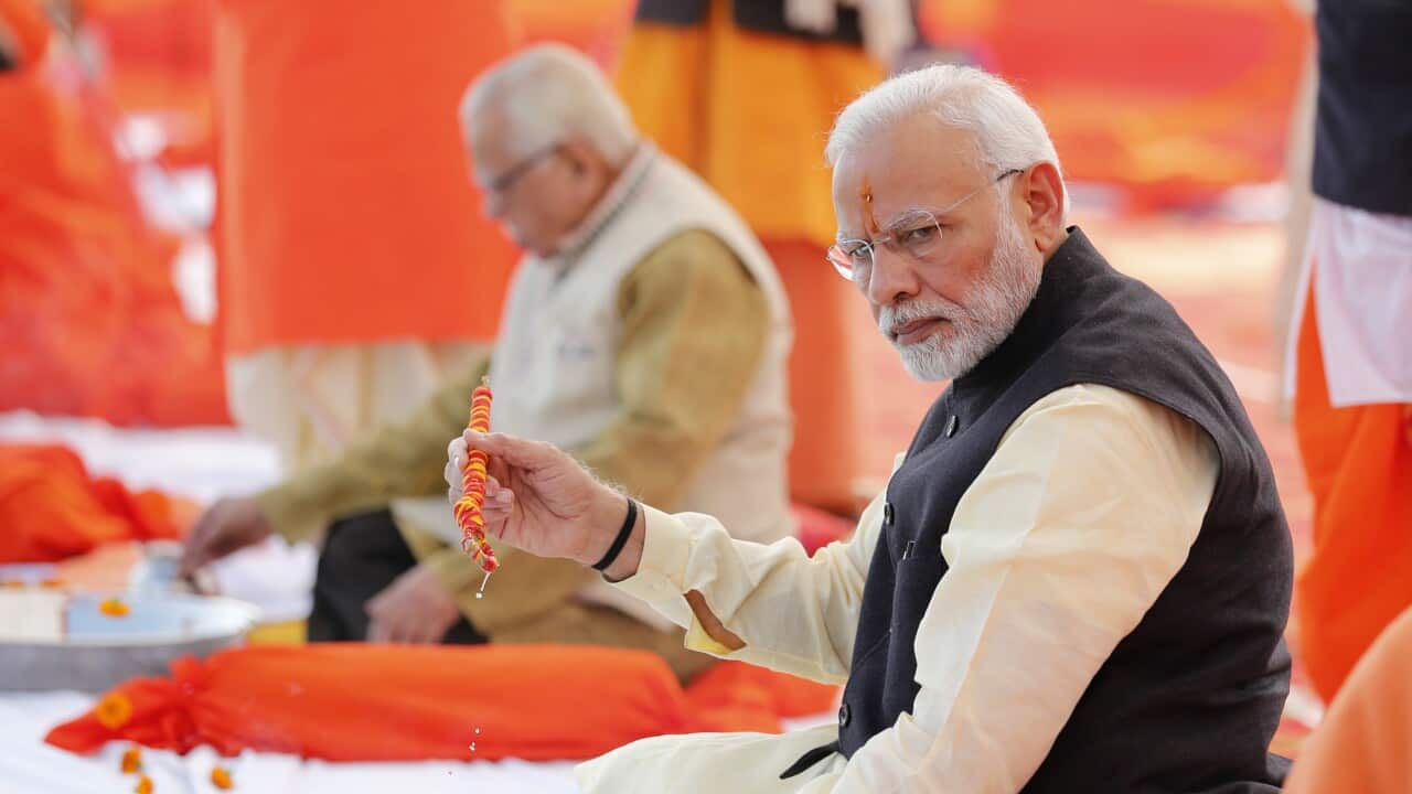 Indian Prime Minister Narendra Modi sitting in a spiritual location in India.