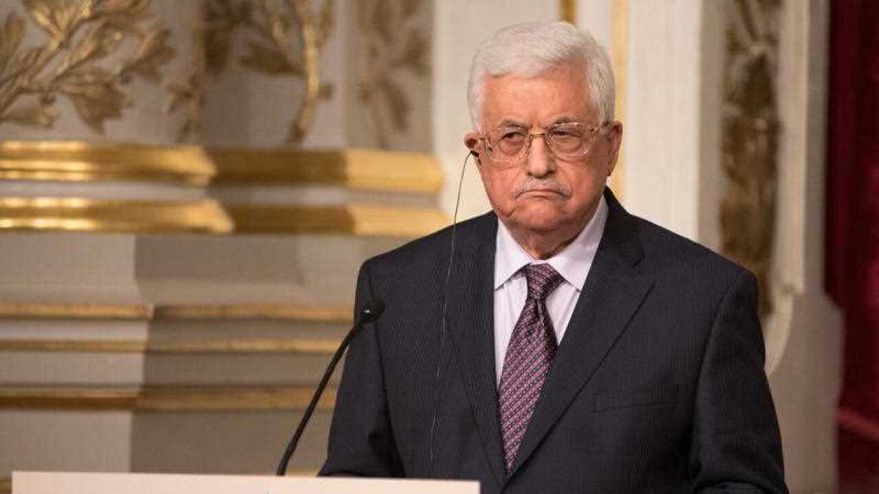 Palestinian President Mahmoud Abbas holds a press conference with French president François Hollande after their meeting at the Elysee Palace in Paris, on April 15, 2016.