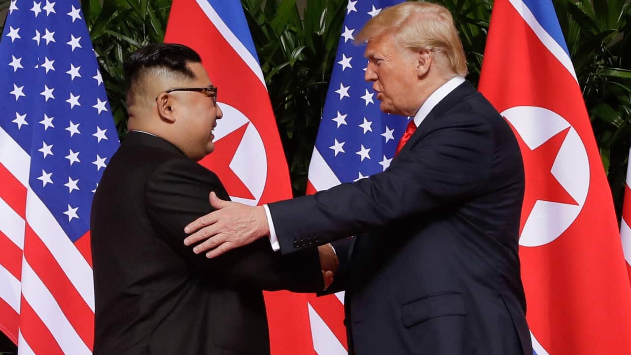 U. S. President Donald Trump shakes hands with North Korea leader Kim Jong Un at the Capella resort on Sentosa Island Tuesday, June 12, 2018 in Singapore.