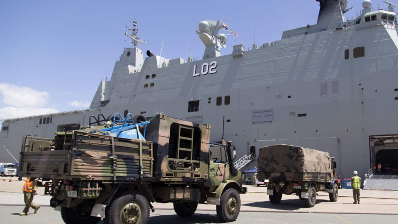 HMAS Canberra prepares to deploy from the Port of Brisbane