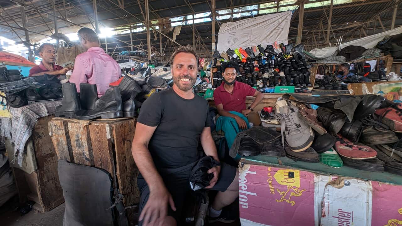 Dario Castaldo in Shoe shop Asmara.jpg