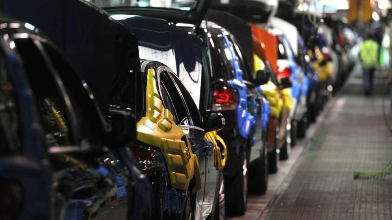 New cars rolling along the assembly line