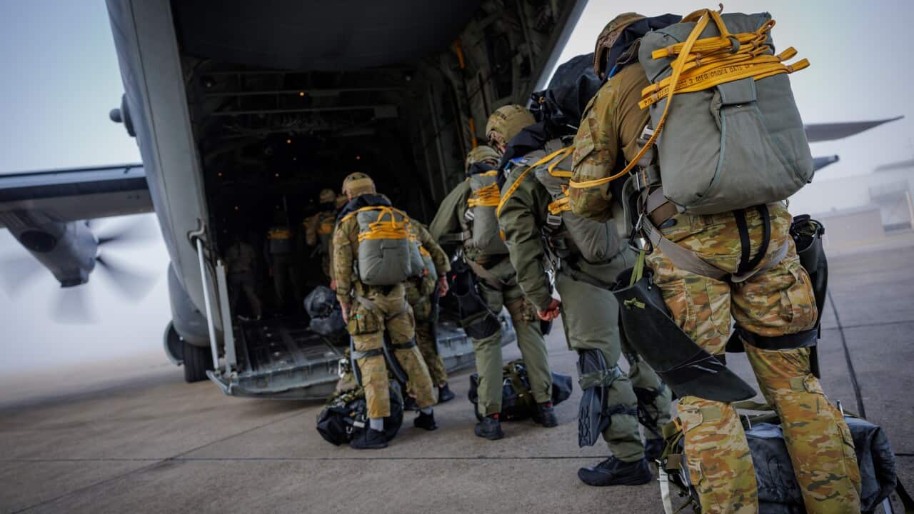 Australian Army special forces soldiers from 2nd Commando Regiment board a United States Air Force MC-130J Commando aircraft assigned to 353rd Special Operations Wing at RAAF Base Richmond in Sydney