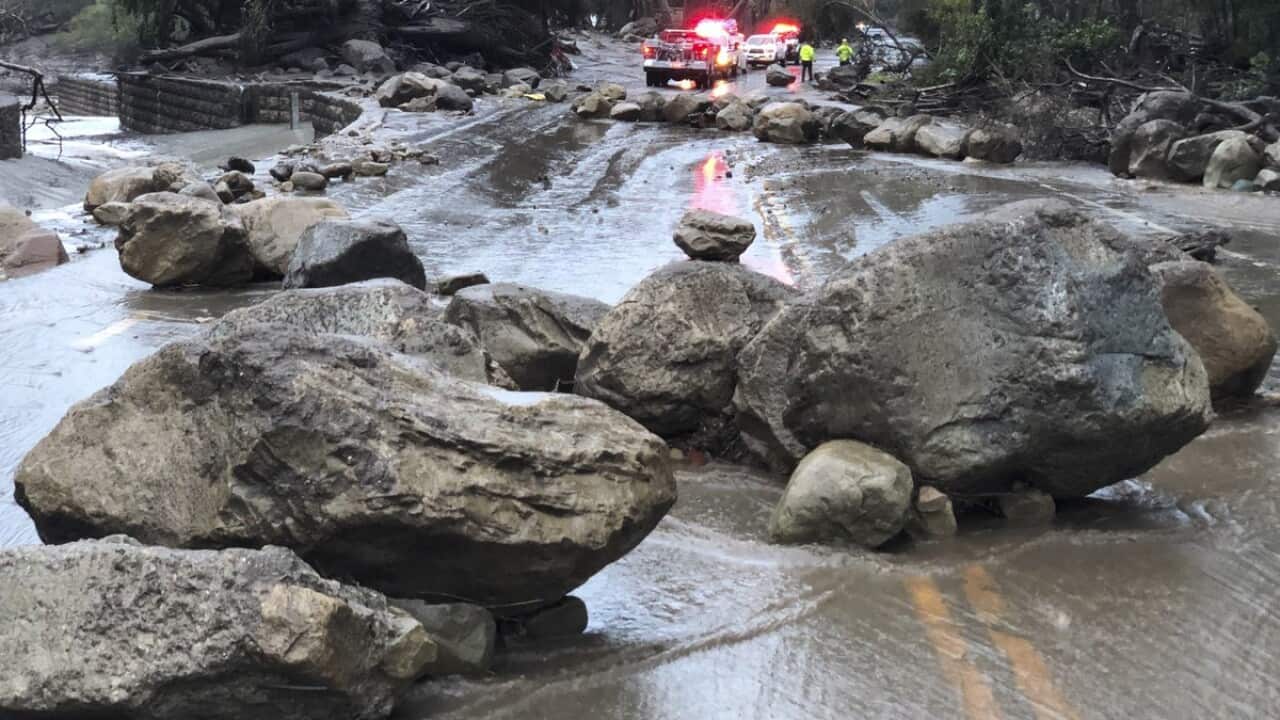 In this photo provided by Santa Barbara County Fire Department, mud and debris flow on the roadway due to heavy rain in Montecito. California Tuesday, January 9, 2018.