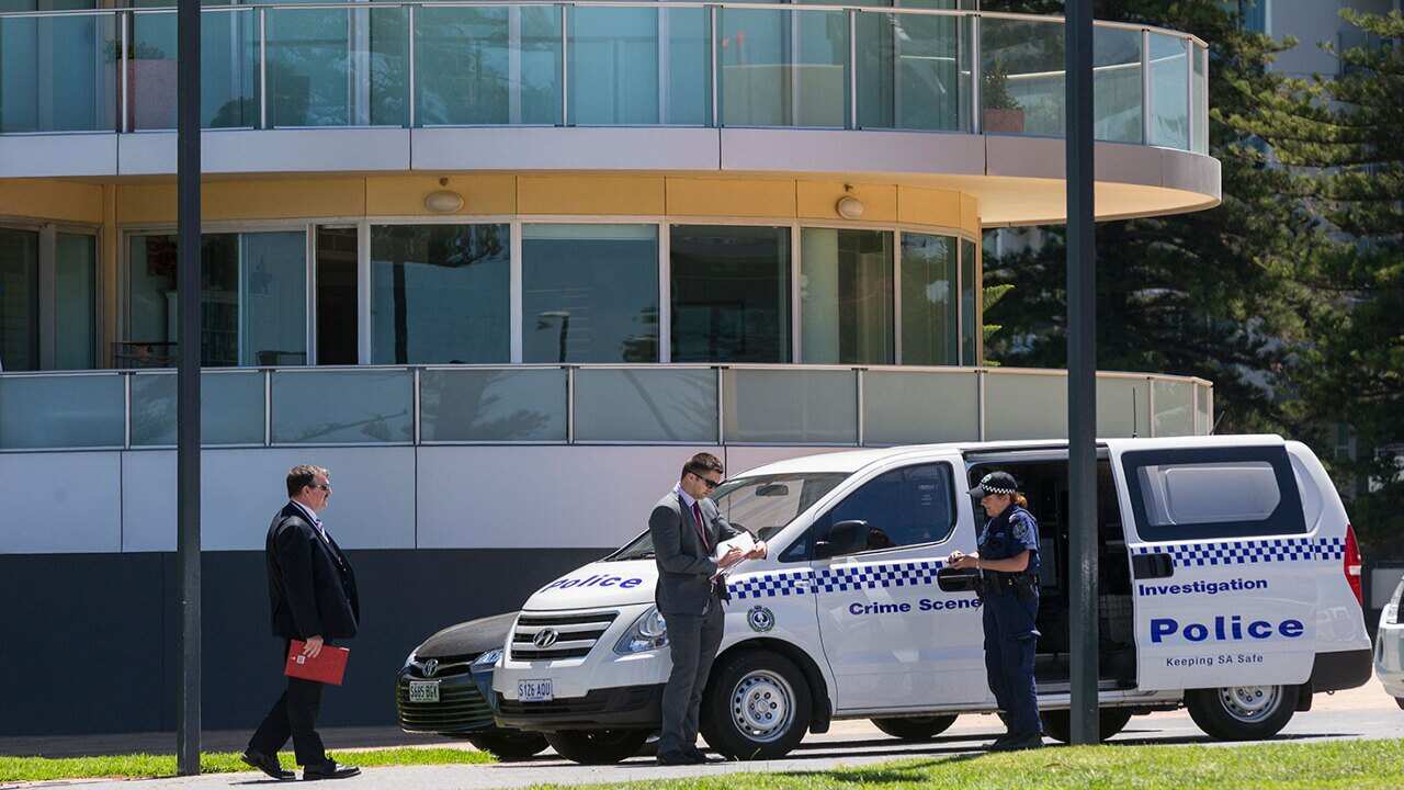 Crime Scene Investigators arrive at Glenelg during a press conference held by Holdfast Shores Lord Mayor Stephen Patterson after the drowning of a teenage girl.