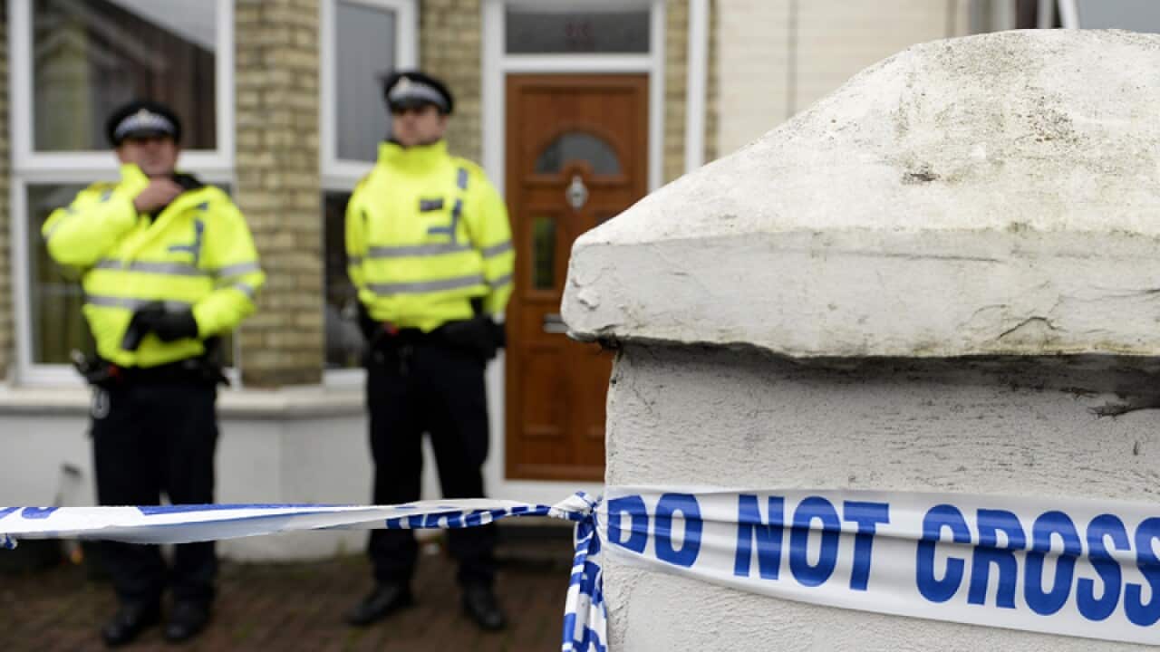 Police officers outside a house in London