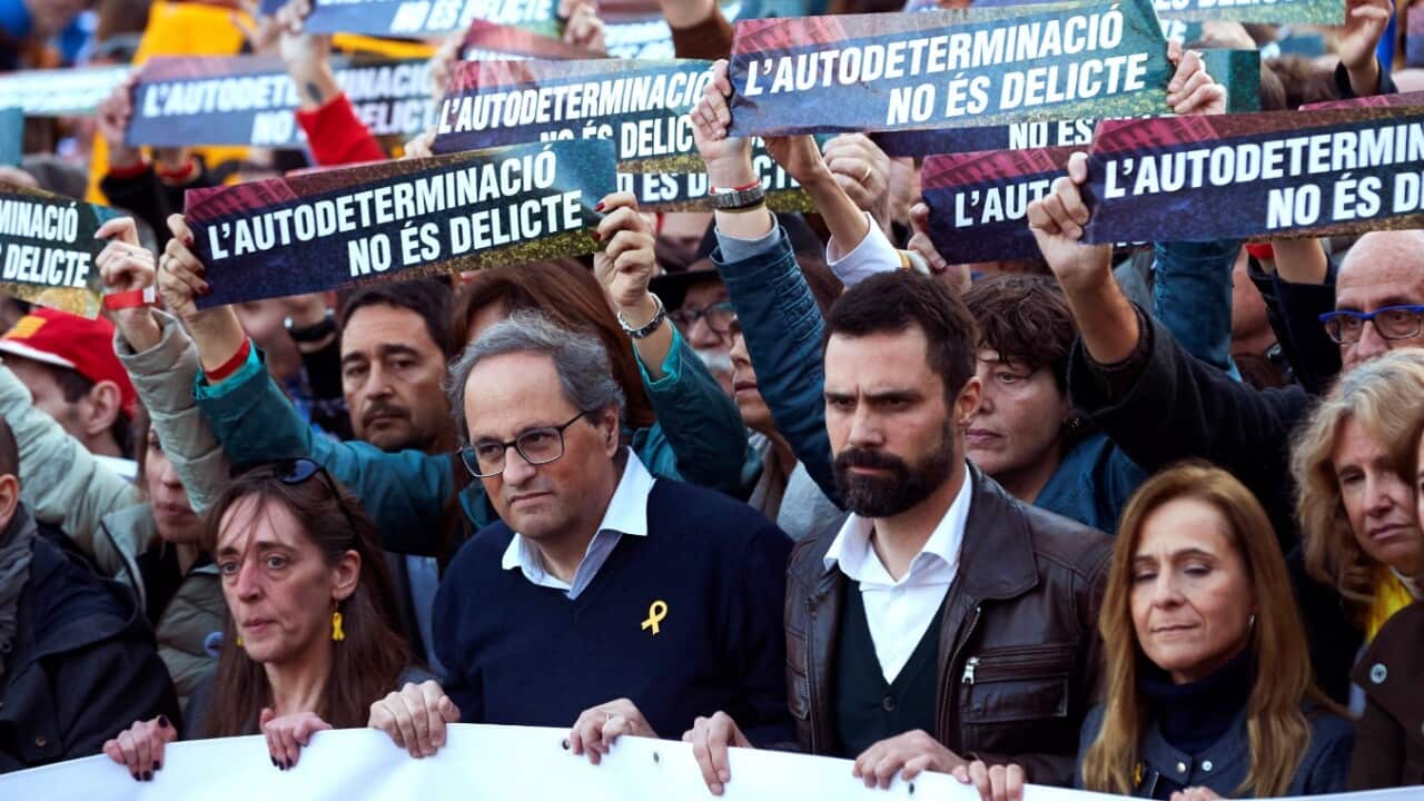 Catalan regional President, Quim Torra (2-L), Catalan regional Speaker, Roger Torrent (2-R), and Montserrat Puigdemont, sister of former Catalan president (L), attend a demonstration
