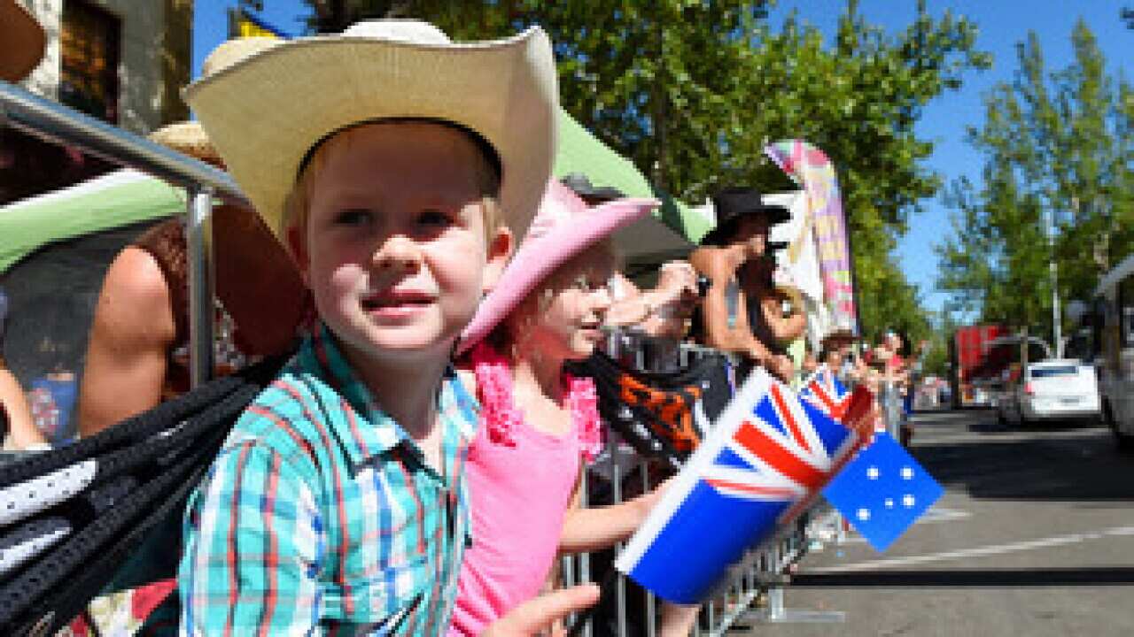 Australians waving national flags on Australian Day