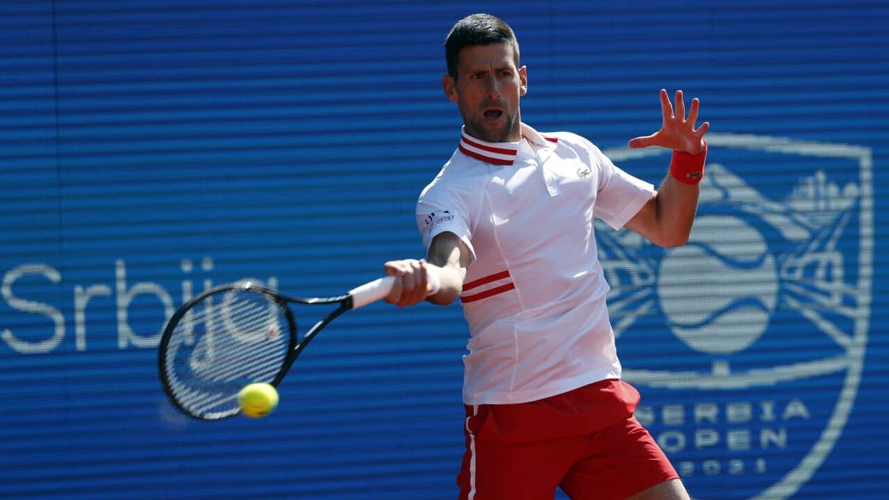 Novak Djokovic of Serbia returns a ball to Miomir Kecmanovic of Serbia during their tennis match of the Serbia Open tennis tournament in Belgrade, Serbia, Friday, April 23, 2021. (AP Photo/Darko Vojinovic)