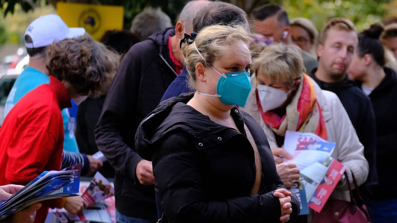 Early voters line up outside an Australian Electoral Commission early voting centre