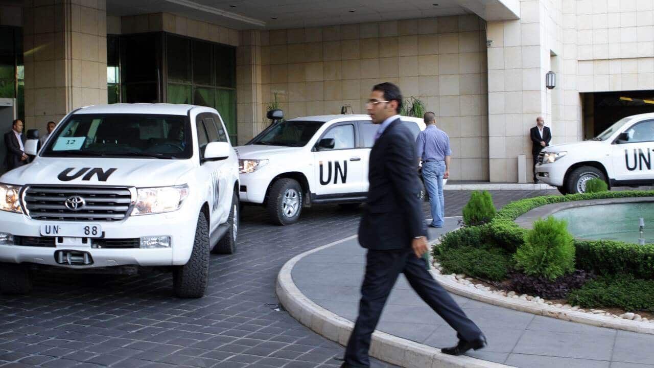 A convoy of United Nations vehicles is seen as a chemical weapons disarmament team arrive in Damascus AAP.jpg
