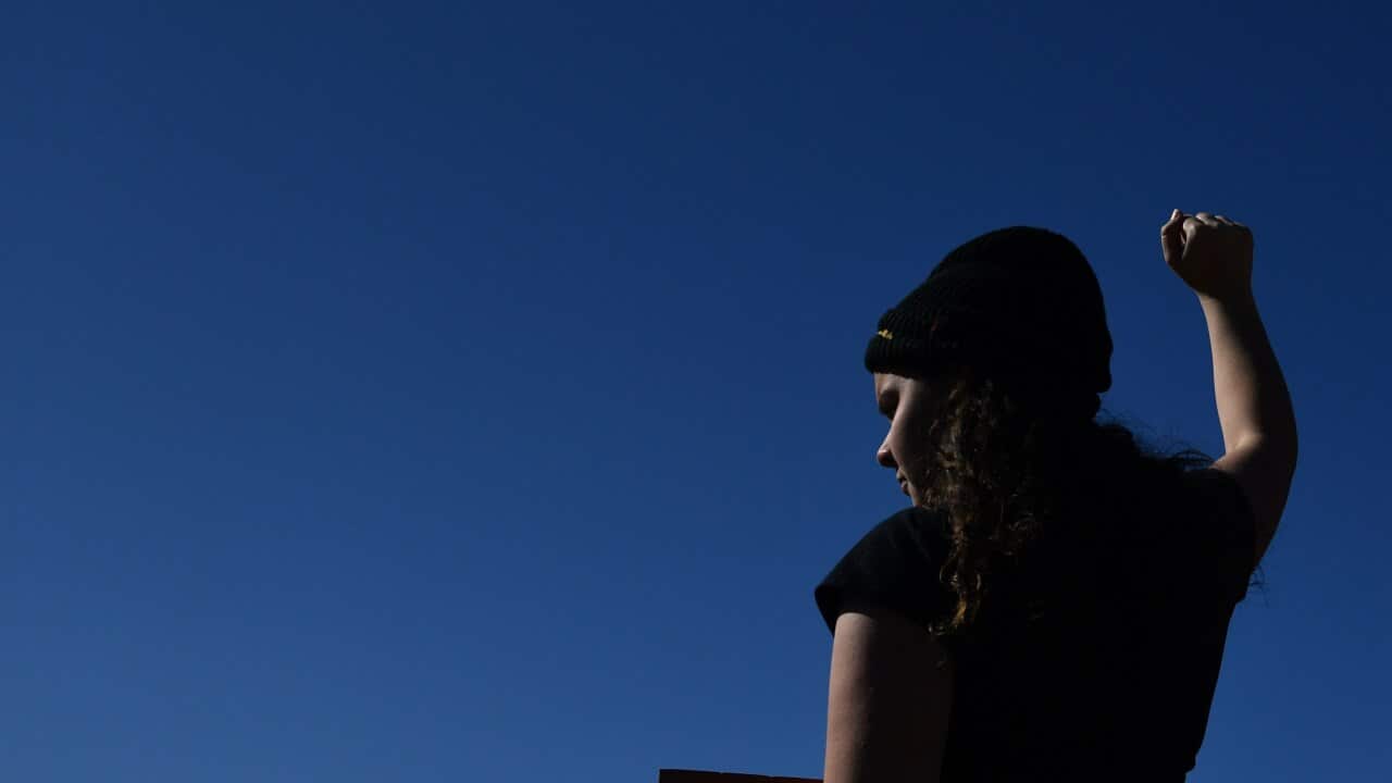 A Black Lives Matter protester in front of Parliament House in Canberra.