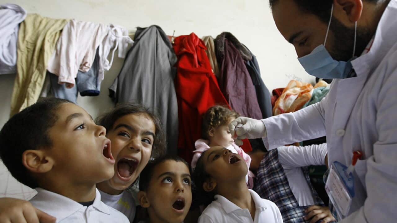 Syrian children line up to receive vaccinations