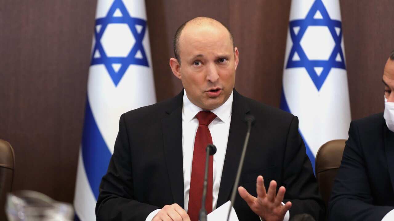 Israeli Prime Minister Naftali Bennett speaks during a cabinet meeting at the prime minister's office in Jerusalem, Israel, Sunday, Dec. 19, 2021. (Abir Sultan/Pool Photo via AP)