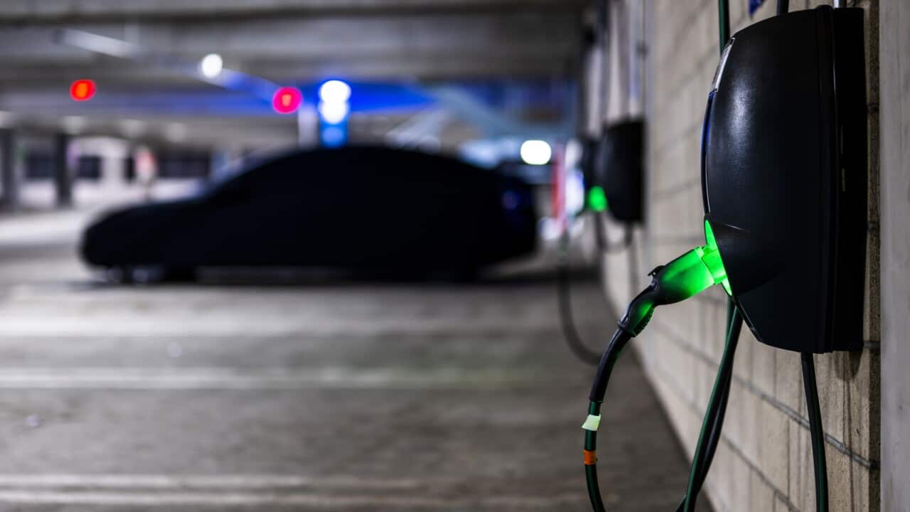 Covered EV seen in the garage while charging