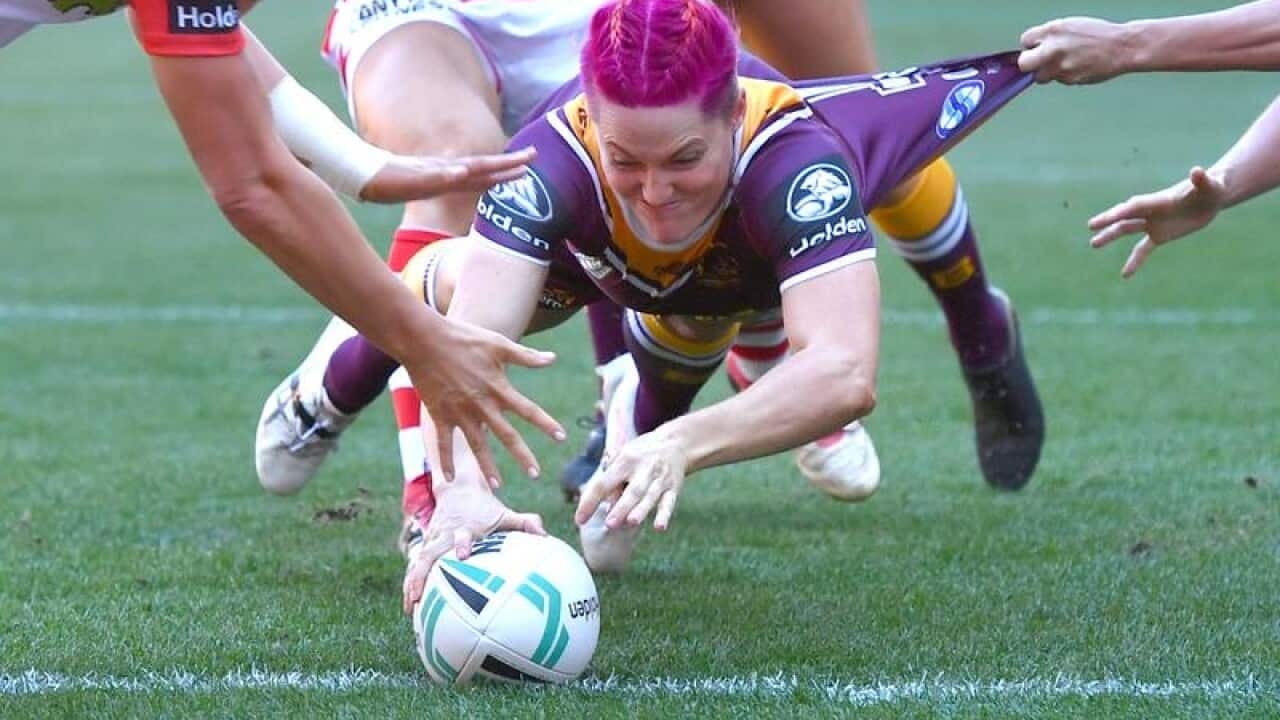 Chelsea Baker of the Broncos scores a try during an NRL Women's match.