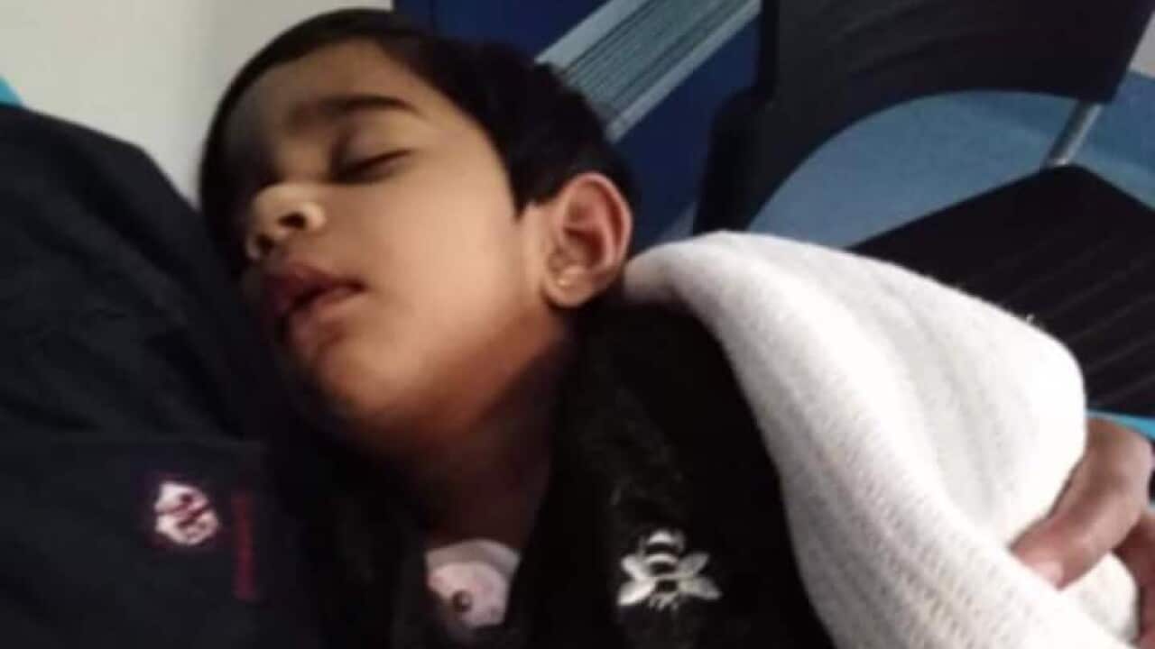 Two-year-old Tharunicaa following the surgery to remove her teeth.