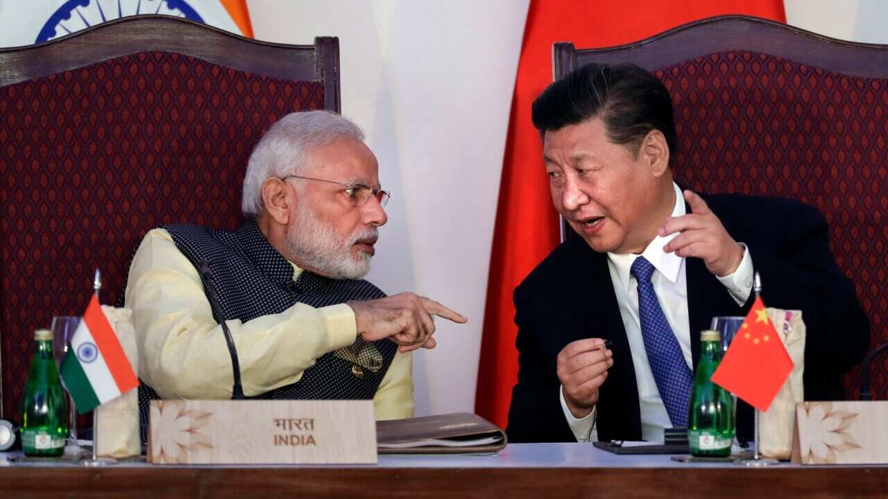 Indian Prime Minister Narendra Modi (left) with Chinese President Xi Jinping during the BRICS summit in Goa, India, Sunday, Oct. 16, 2016.