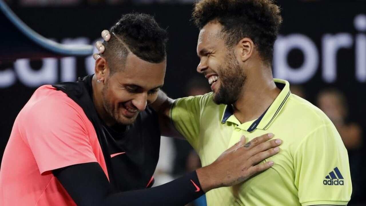 France's Jo-Wilfried Tsonga(R) congratulates Australia's Nick Kyrgios after winning their third round clash