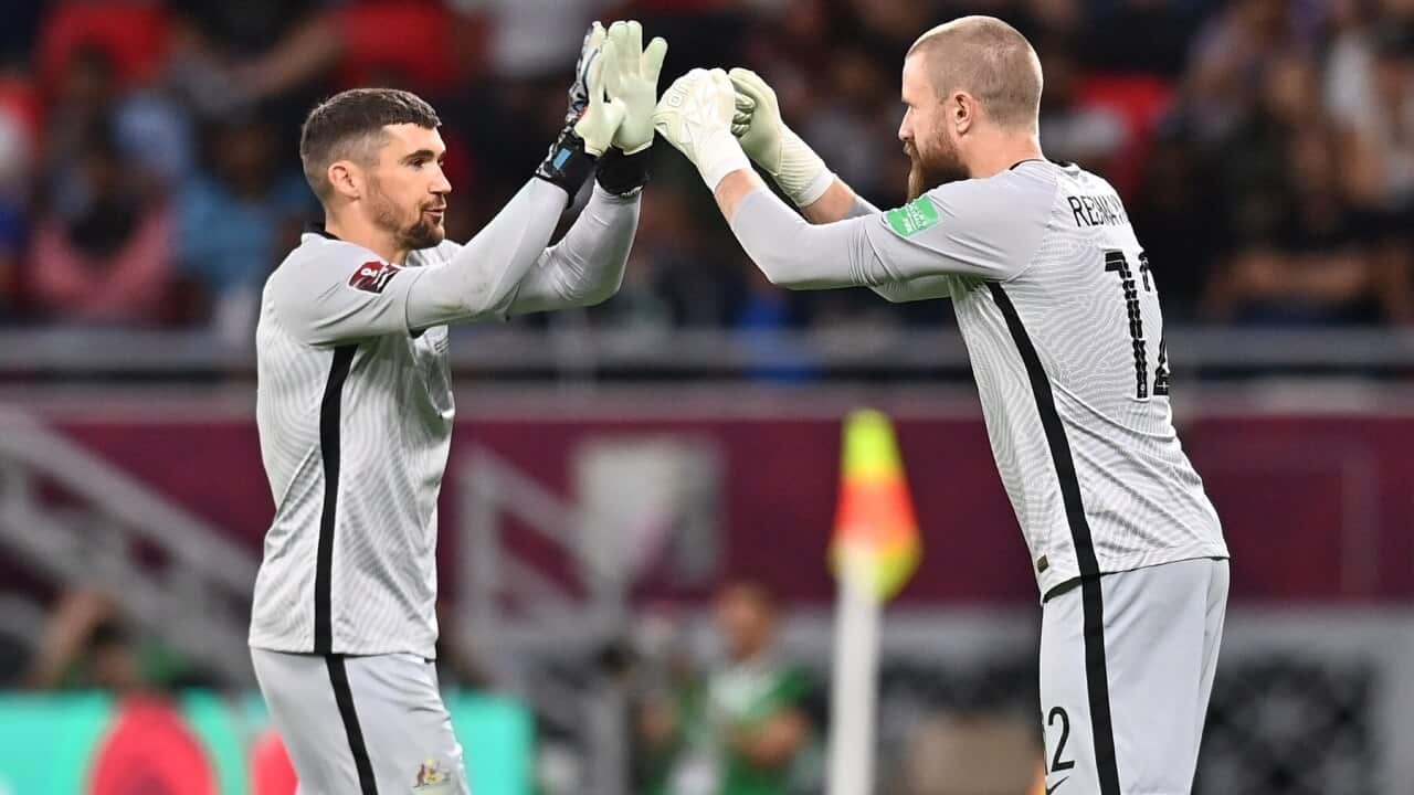 Australia's goalkeeper Mathew Ryan (L) is replaced by teammate Andrew Redmayne (R)