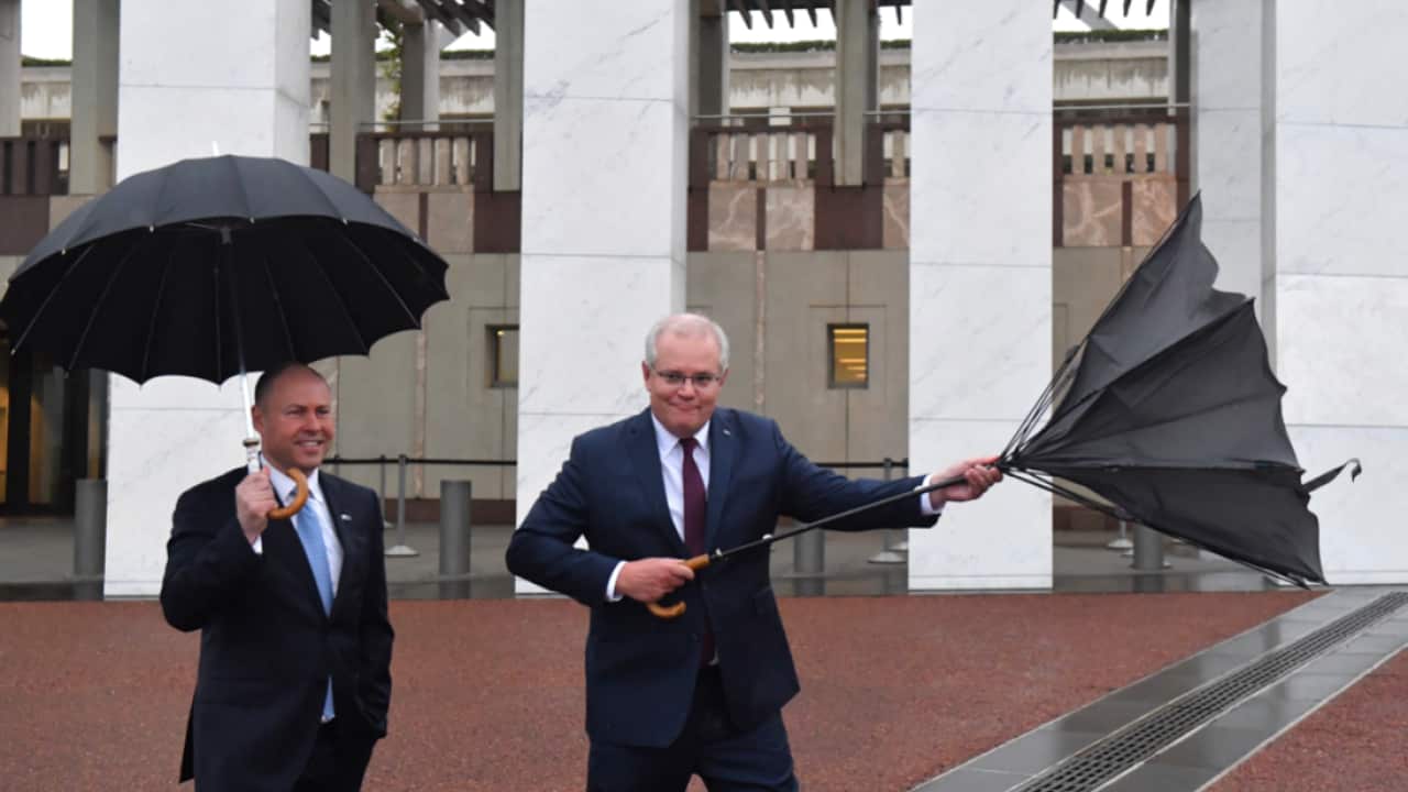 Treasurer Josh Frydenberg and Prime Minister Scott Morrison outside Parliament House in Canberra, Wednesday, October 7, 2020.