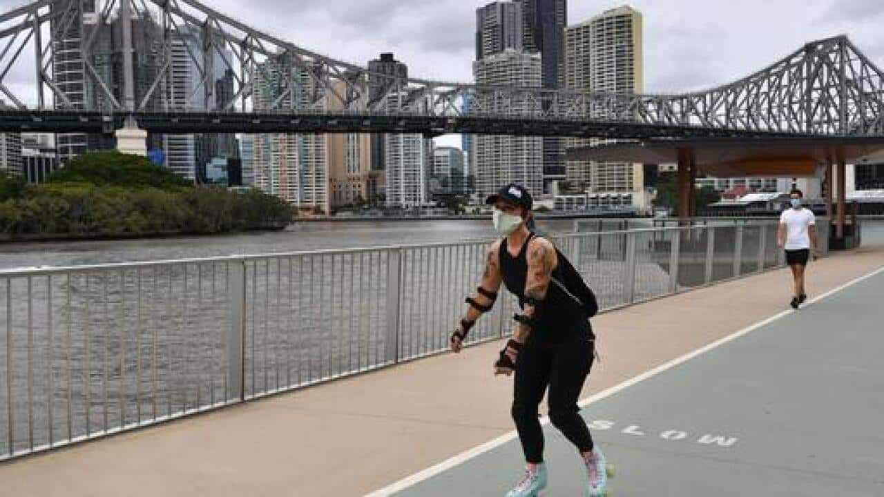 A women on roller-skates is seen exercising along the New Farm Riverwalk in Brisbane, Saturday, January 9, 2021. Residents of Greater Brisbane face mandatory lockdown over the weekend in a bid to contain the highly contagious UK variant of COVID-19.