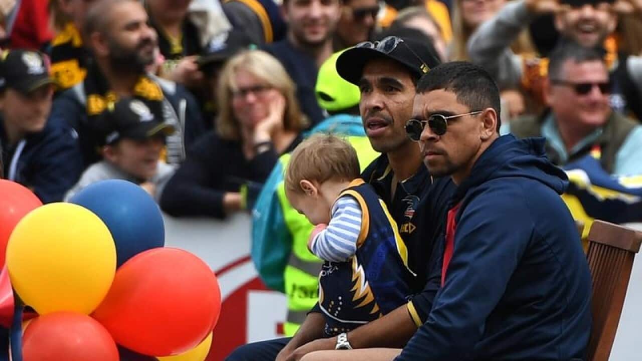 Eddie Betts and Charlie Cameron are seen during Grand Final parade.