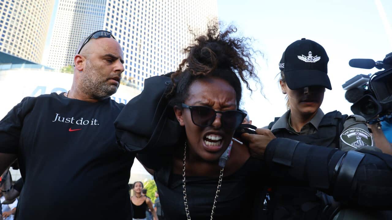 Security forces take a protester into custody during a protest against the killing of Solomon Tekah, in Tel Aviv, Israel on July 03, 2019.