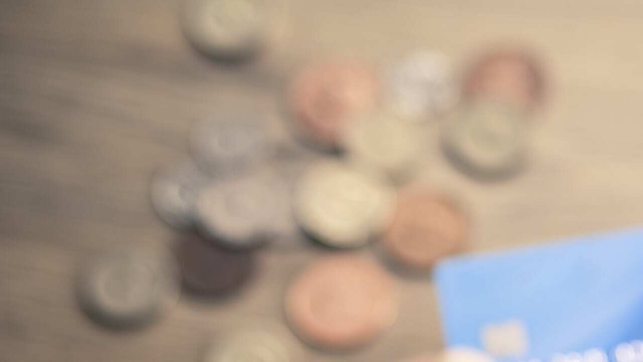 Mans hands photographing credit card using smartphone