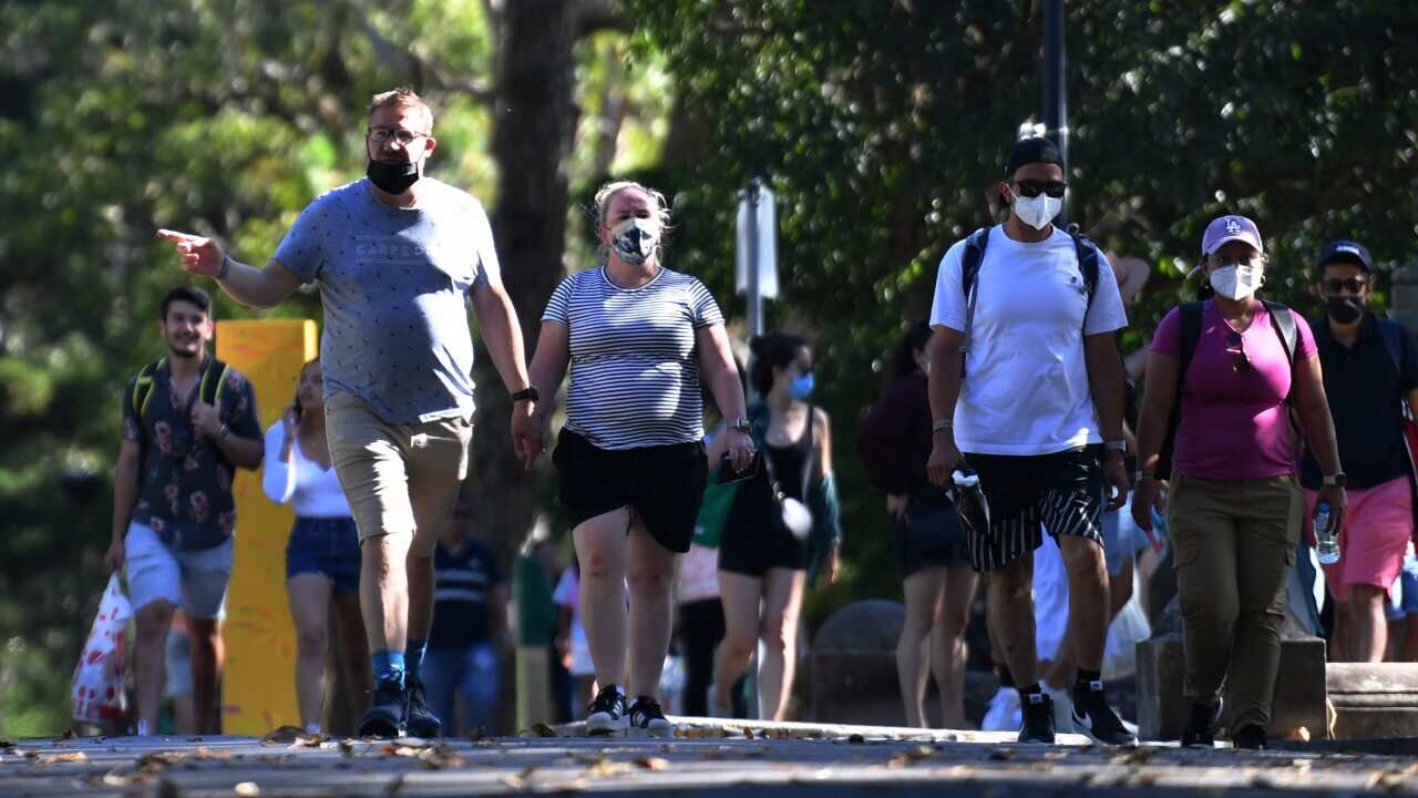 New Years Eve revellers arriving at Mrs Macquaries Chair ahead of New Years Eve celebrations in Sydney, Friday, 31 December, 2021.