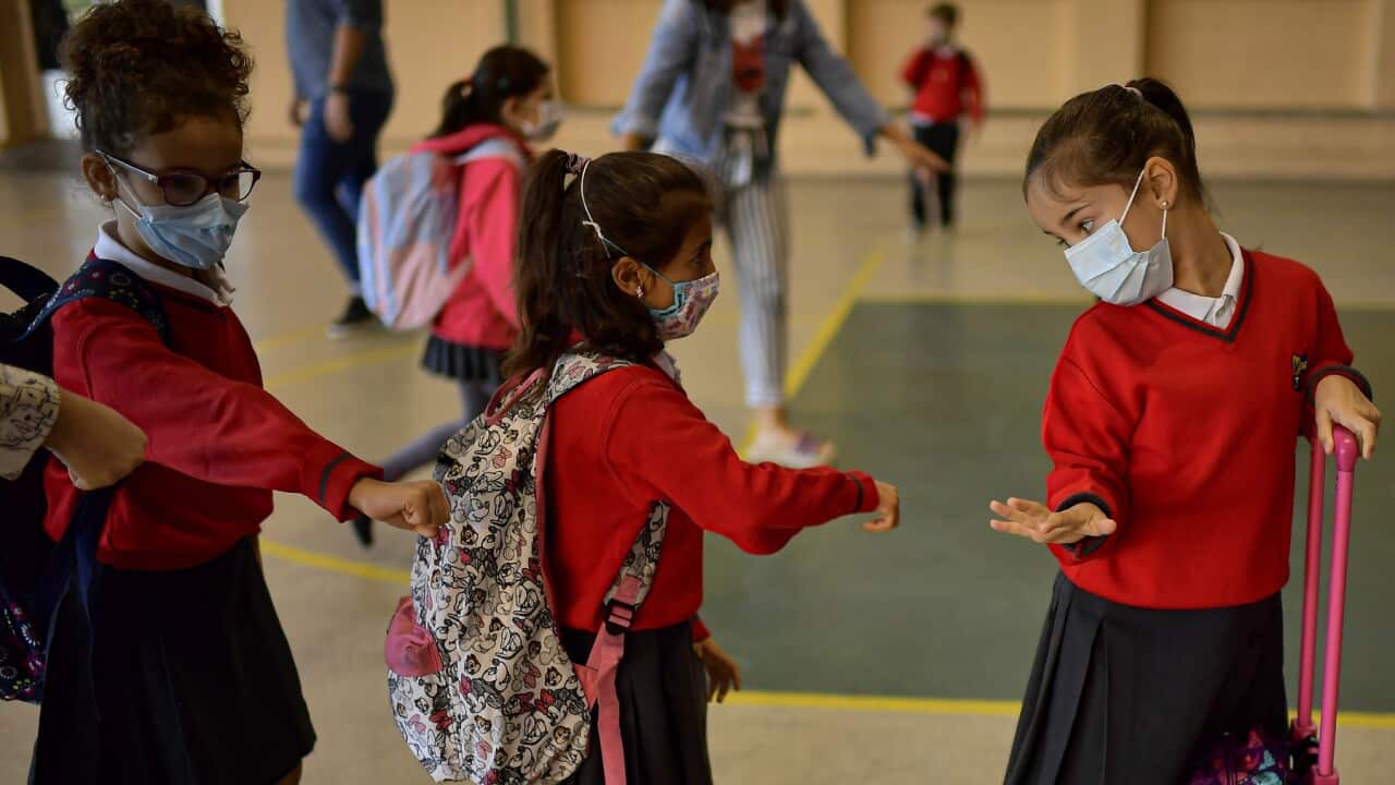 Young students waiting to go into school in Pamplona, northern Spain